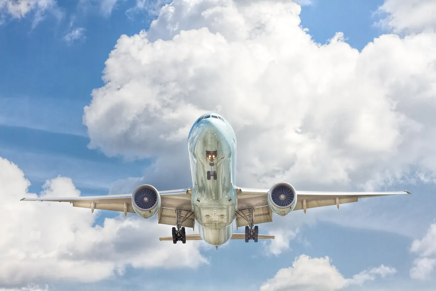 Airliner landing above the clouds