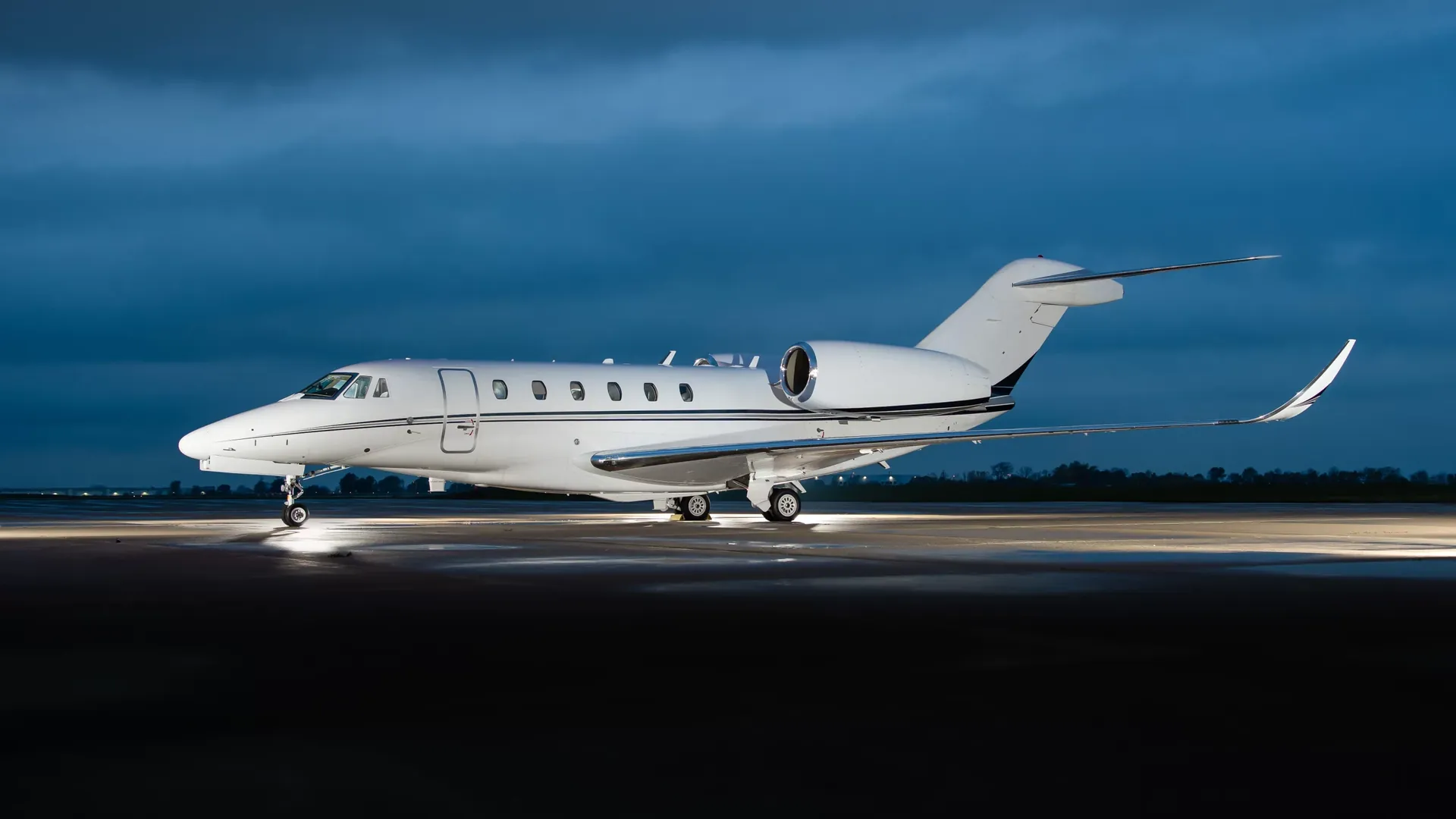 Business jet on the ramp at night